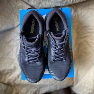 Used pair of HOKA shoes